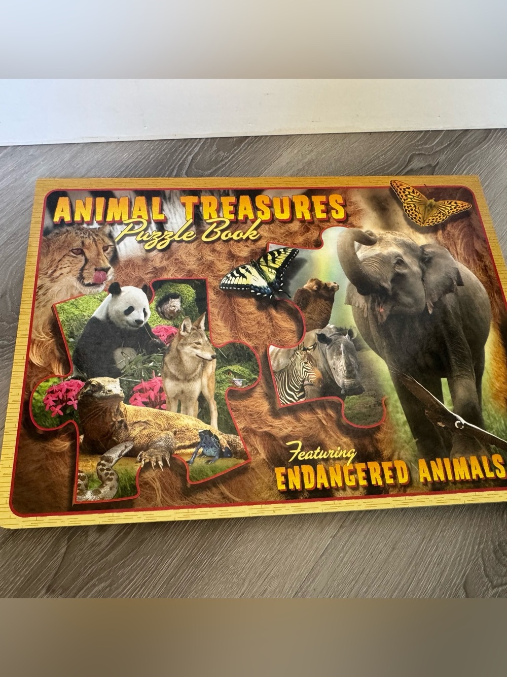 Animal treasures large puzzle book featuring endangered animals